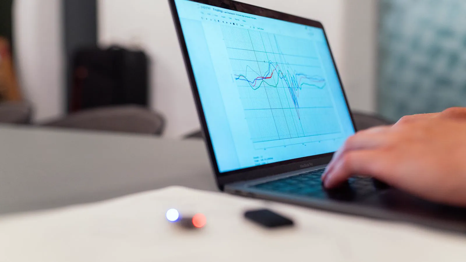 An engineer reviewing a data analysis chart on a laptop
