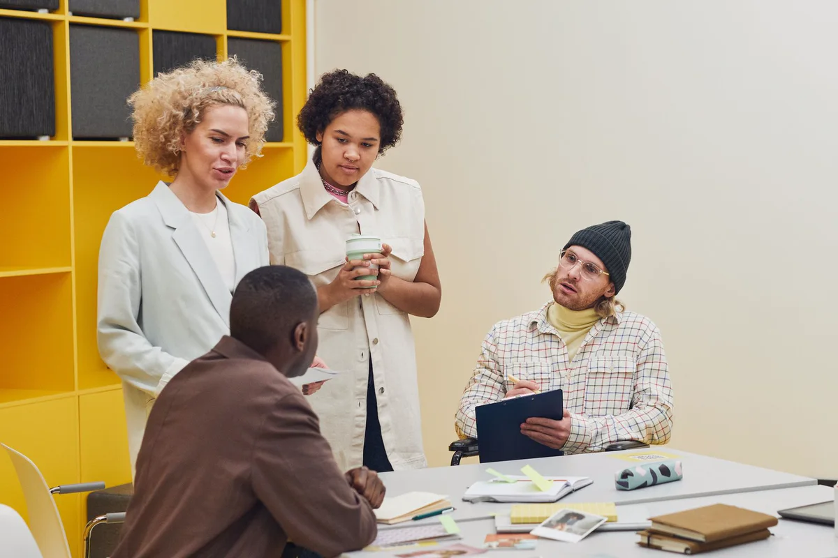 A project team gathered around a table at the start of an engagement